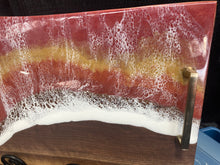 Load image into Gallery viewer, Live Edge Maple, rich browns and warm golds food safe epoxy covering 90% of wood in a wave pattern white, clear, medium reds, golds with brass handles.
