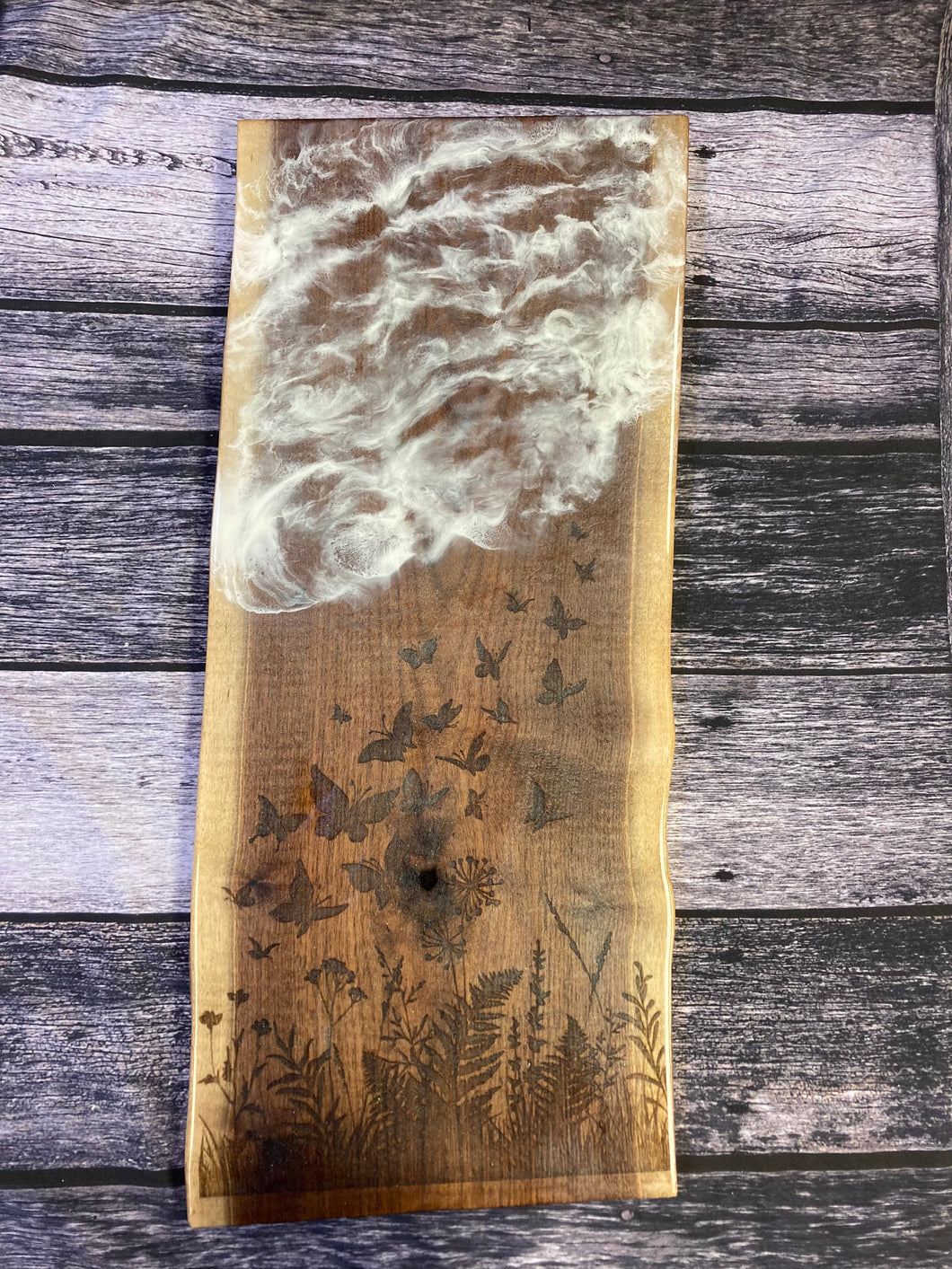Laser engraved clouds and wildflowers